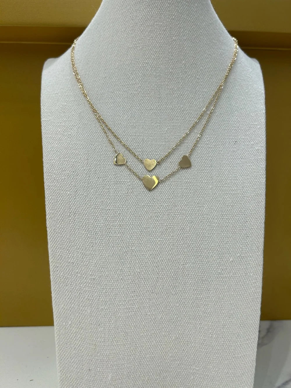 Double row necklace with heart pendants